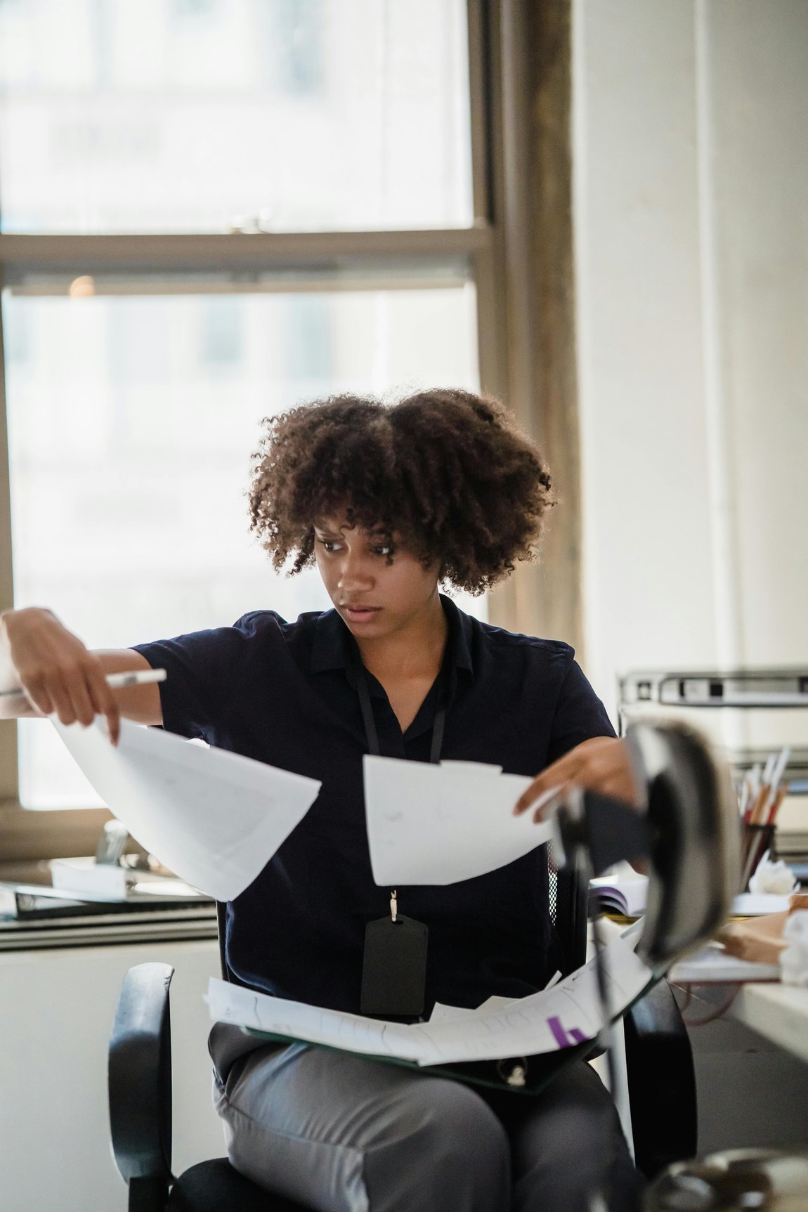 A focused professional concentrating on her work