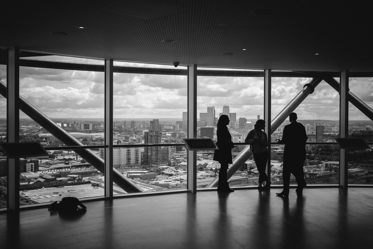 Professionals looking out over a city skyline